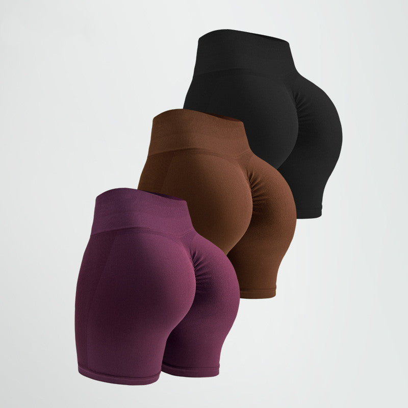 three pairs of seamless high stretch tummy control high waist activewear shorts in purple, brown, and black for women gym-wear on a white background