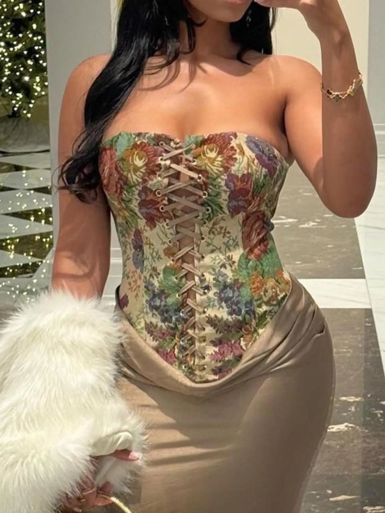 Model wearing floral print lace-up tube top for summer