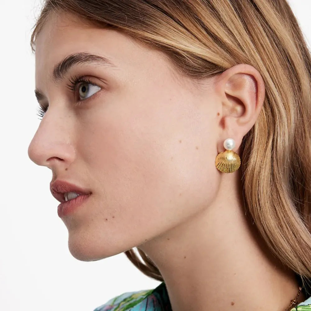 Model wearing 18K gold plated stainless steel shell earrings for women
