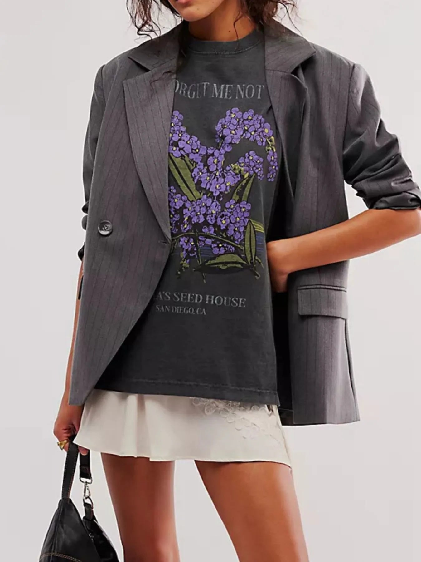 Model wearing graphic streetwear tee with relaxed fit with floral design
