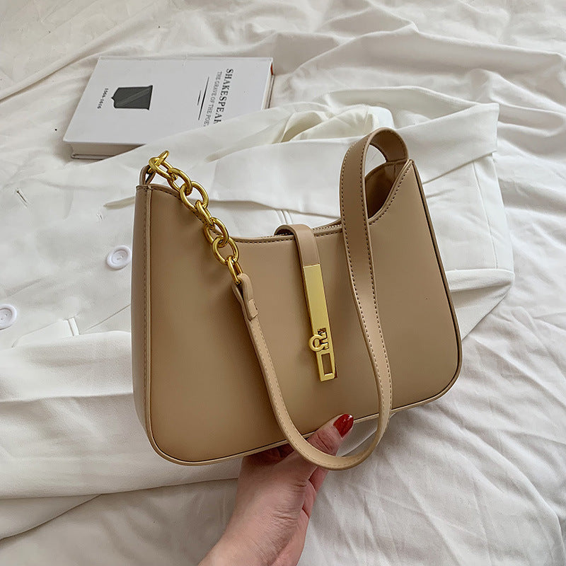 Tan/brown minimalist shoulder bag with gold chain strap detail