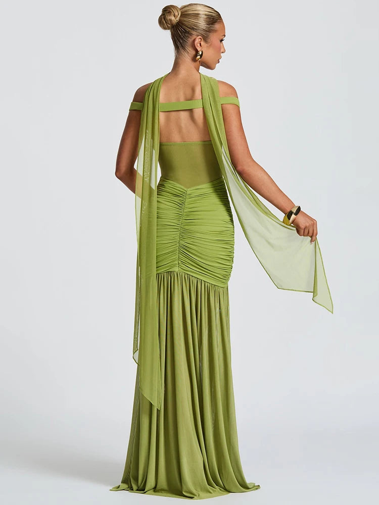 Model showcasing open back of the formal green maxi dress