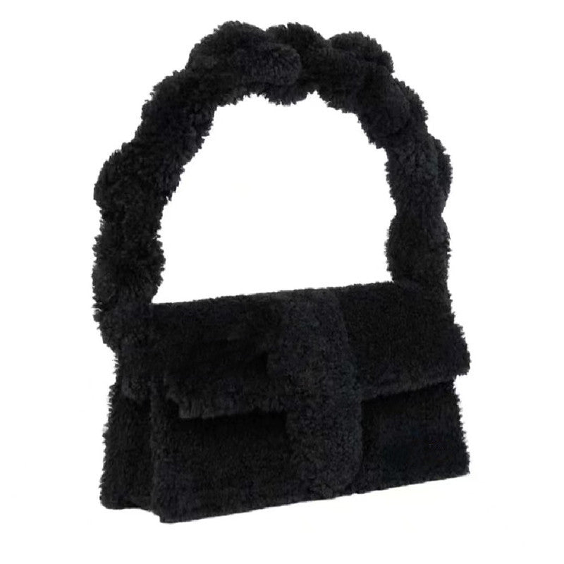 Soft fuzzy black sherpa purse with structured flap and chunky handle