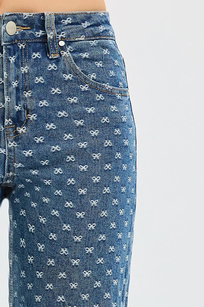 Close up of Blue jeans with white bow pattern on a white background