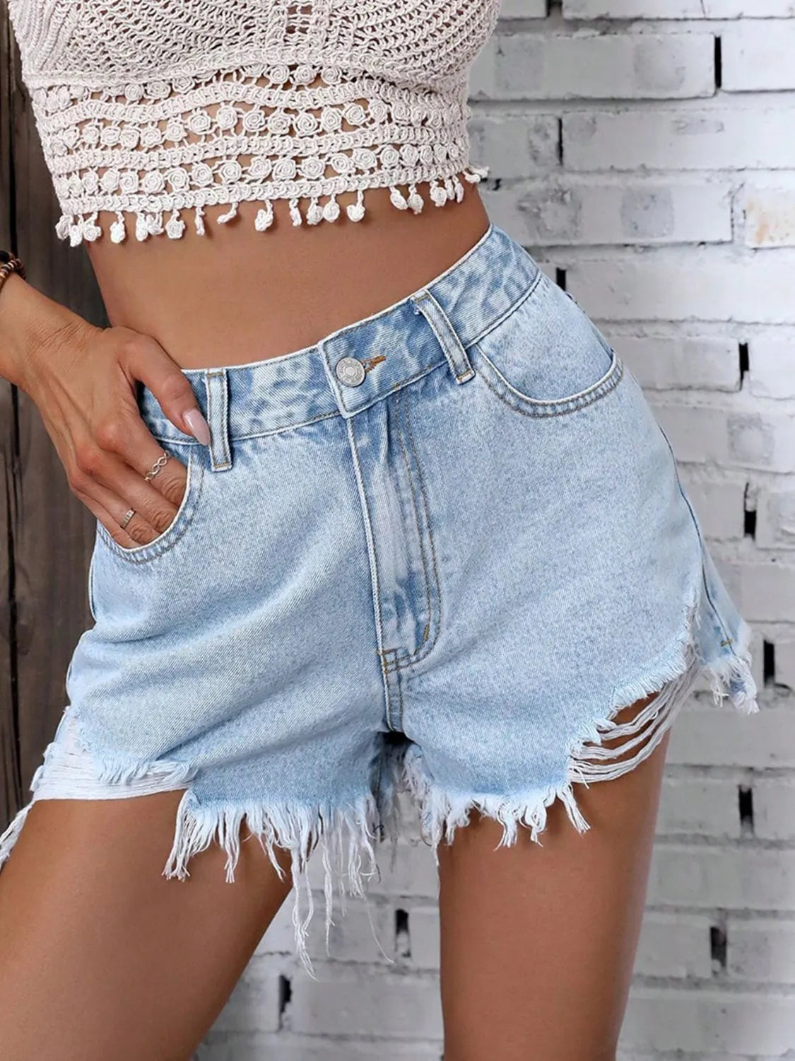 Person wearing high waisted Raw Hem Distressed Denim Shorts