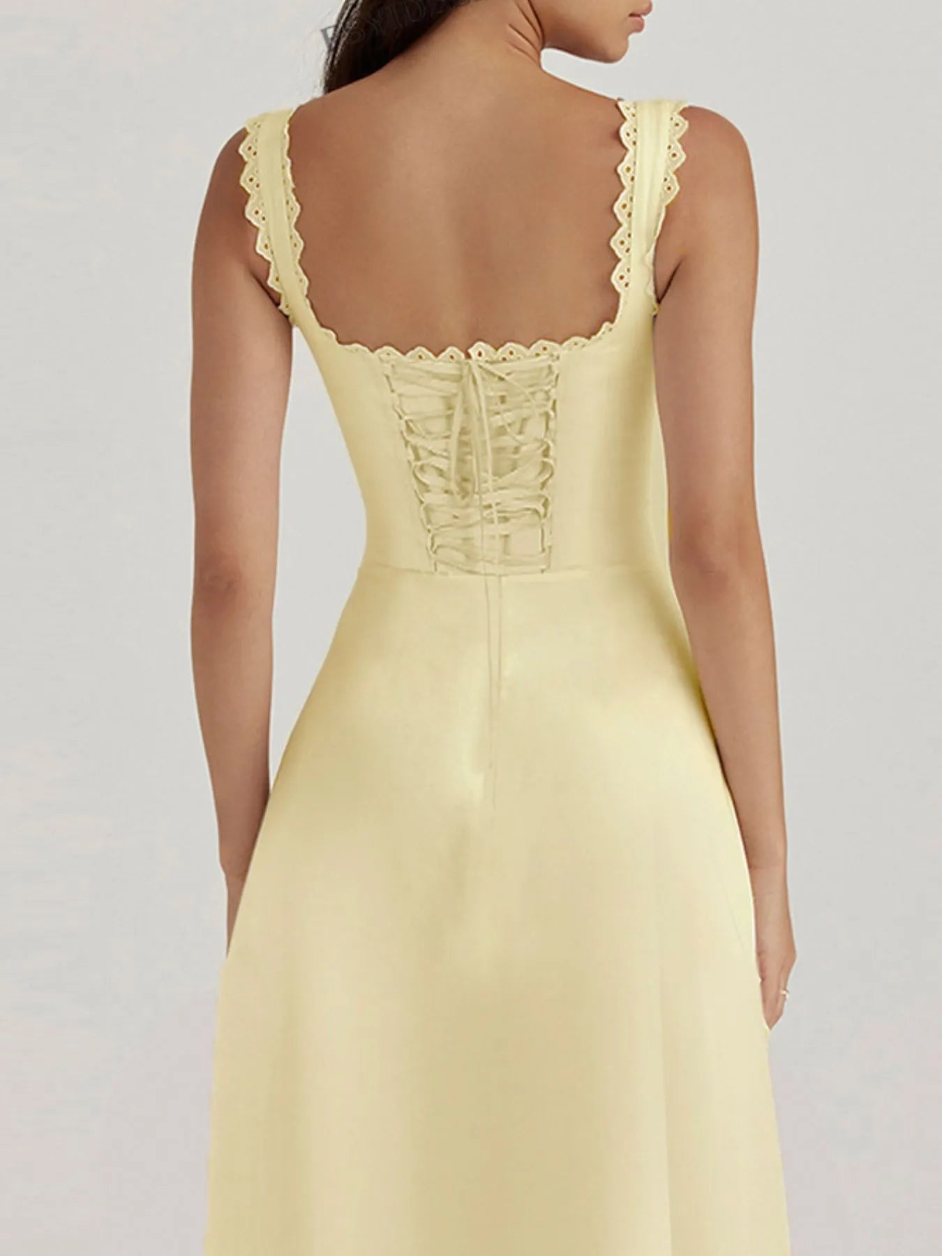 back close up of yellow Scalloped V-Neck Midi Dress with Back Lace-Up detailing on a model