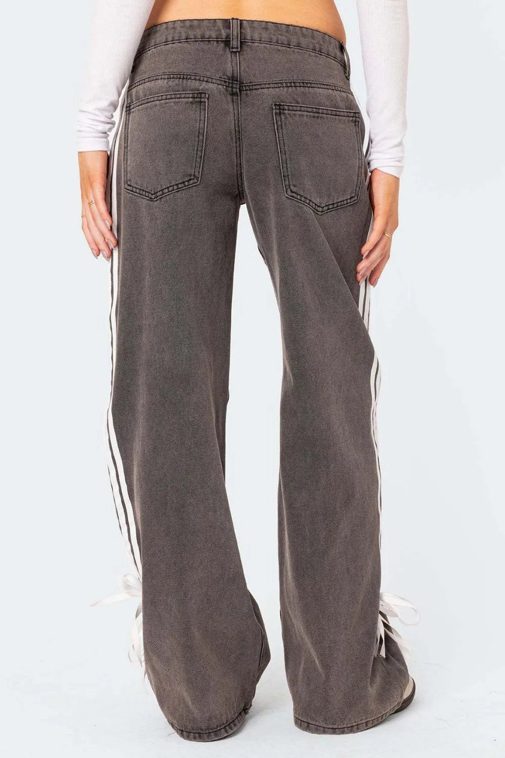 Model wearing dark wash side Striped Loose Fit Jeans back view