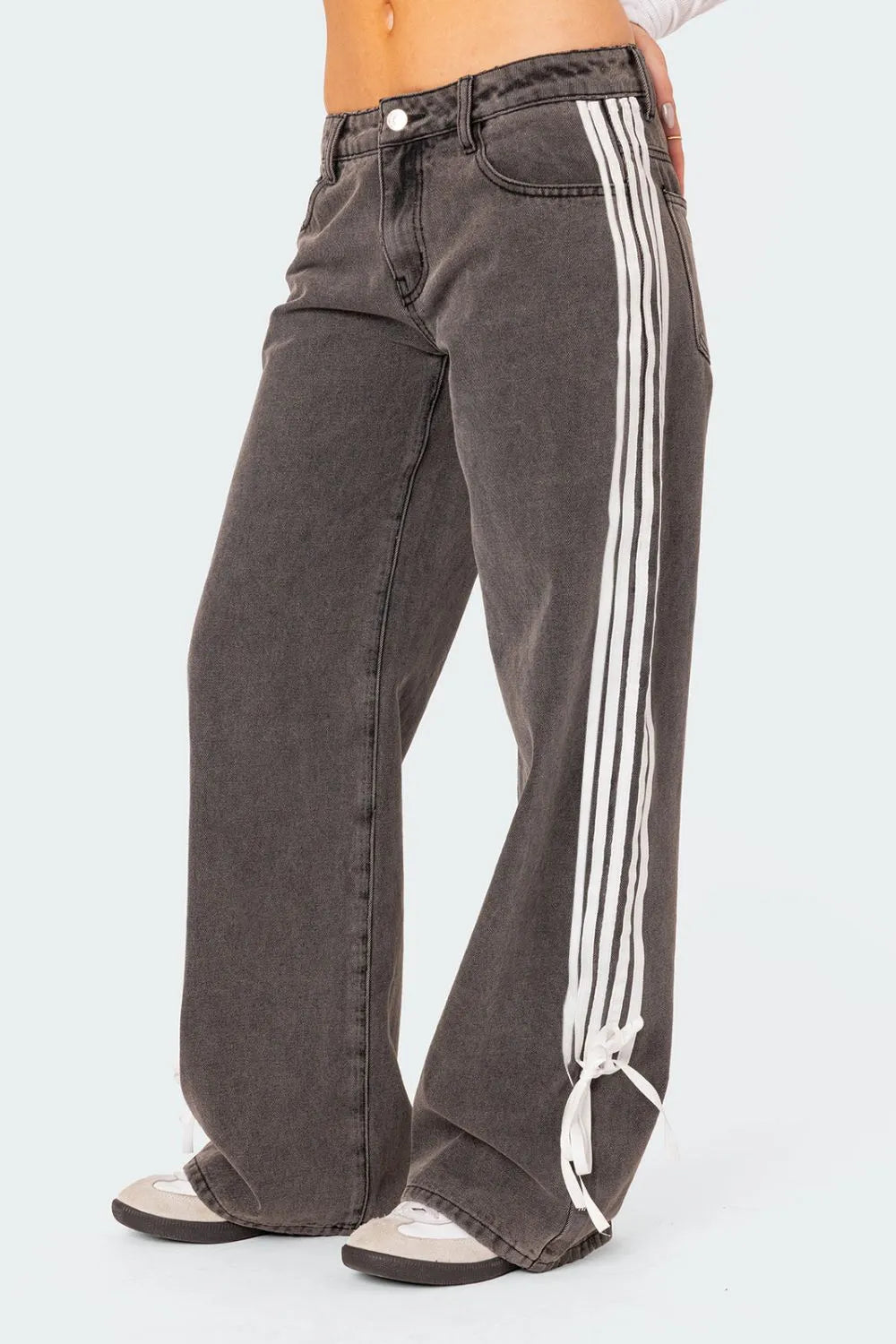 Model wearing dark wash side Striped Loose Fit Jeans side view