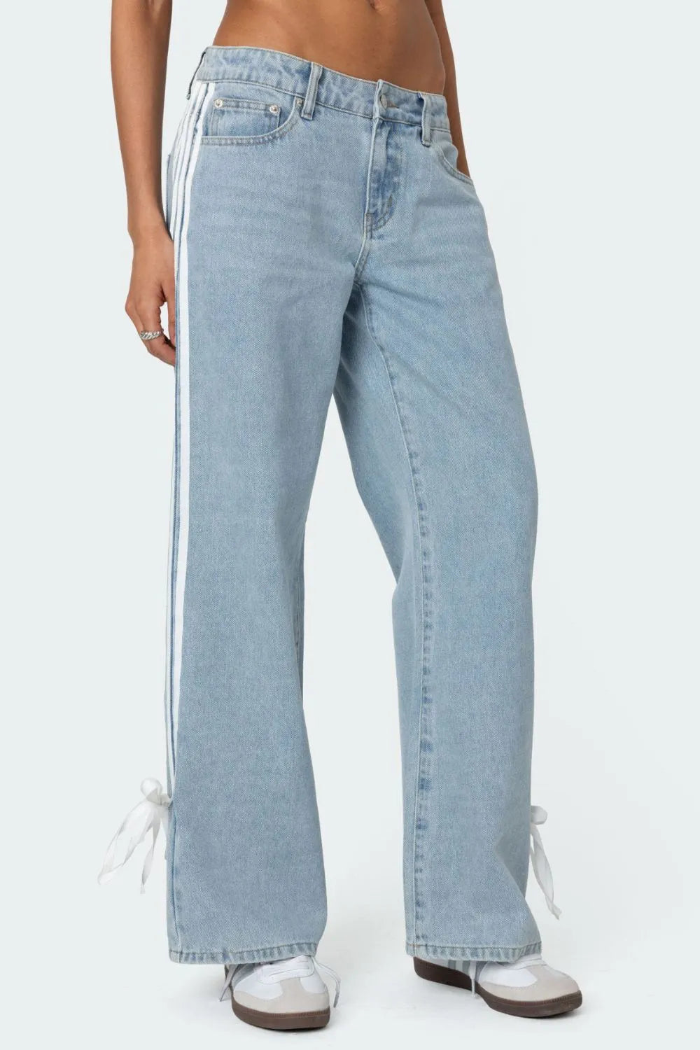 Model wearing light wash side Striped Loose Fit Jeans front view