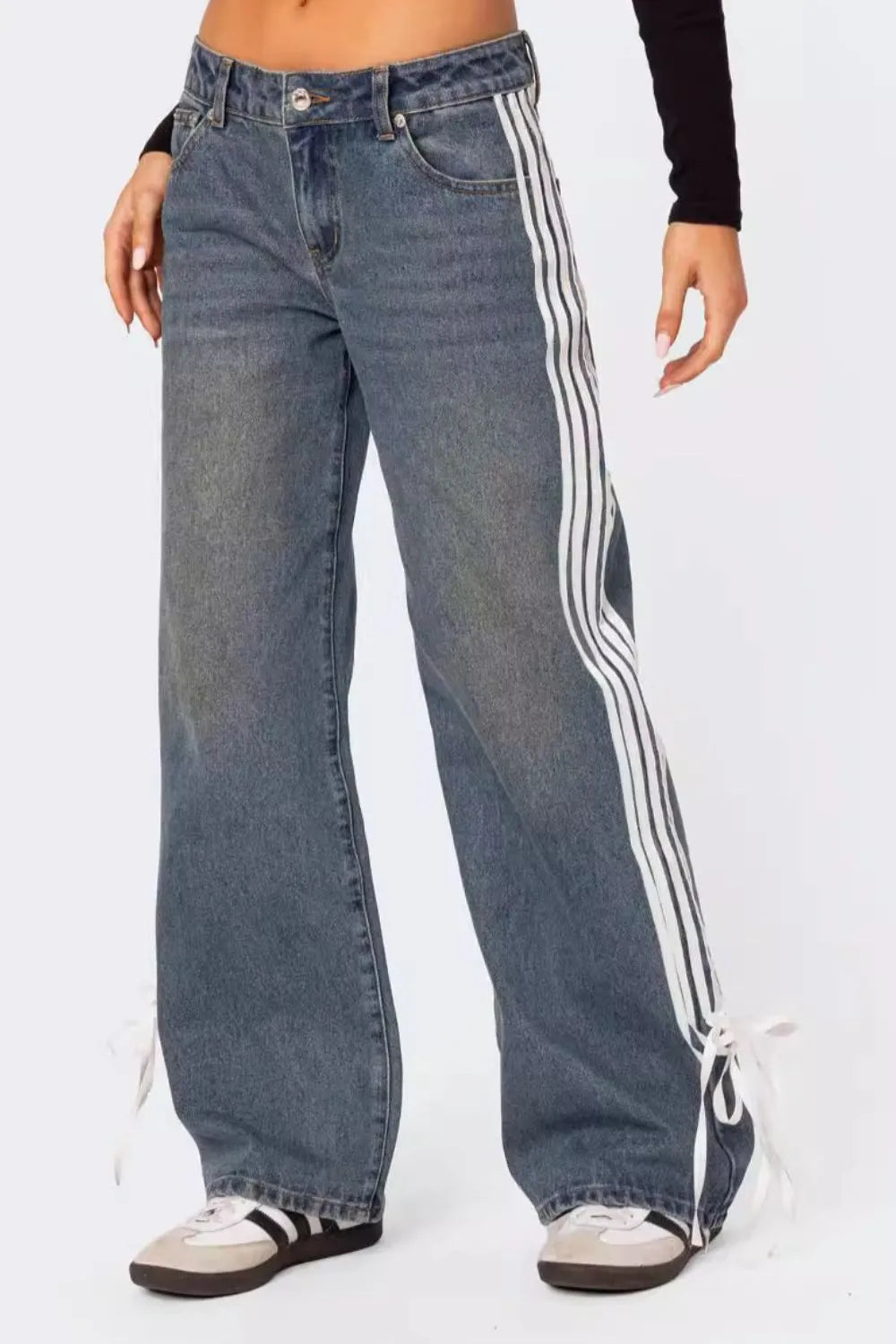 Model wearing medium wash side Striped Loose Fit Jeans front view