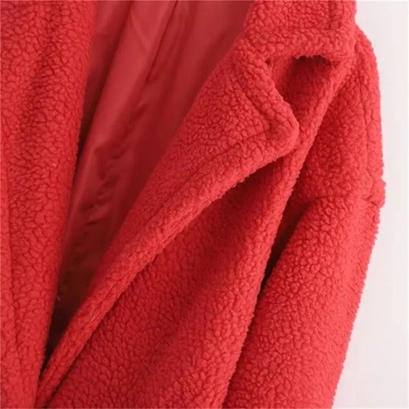 Close-up of collared neckline of a red plush teddy coat for women