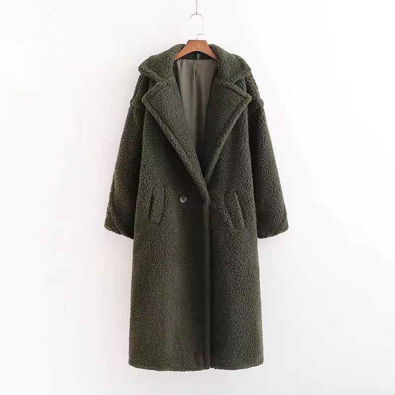 A long dark green teddy coat with long sleeves, front button and pockets, displayed on a hanger against a white background.