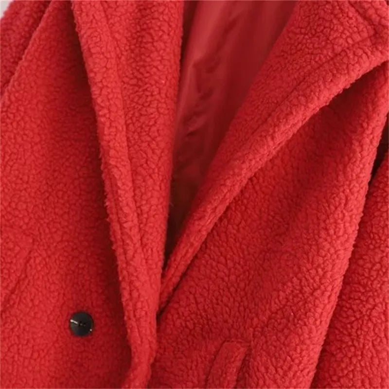Close-up of neckline of a red plush teddy long coat with front buttons for women outwear