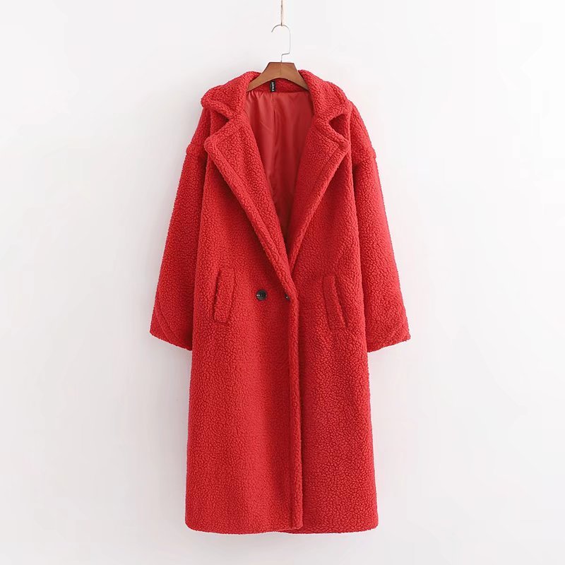 A long red plush teddy coat with long sleeves front button and pockets, displayed on a hanger against a white background.
