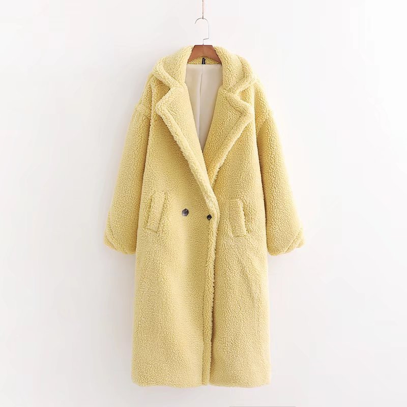 A long yellow teddy plush coat with long sleeves, front buttons and pockets, displayed on a hanger against a white background.