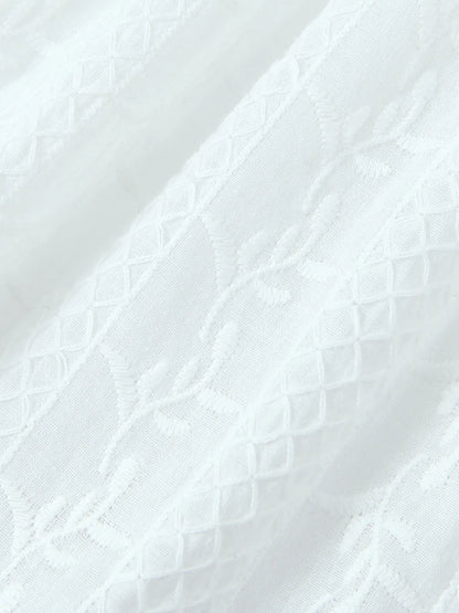 Close-up of lace mini dress in white fabric texture 