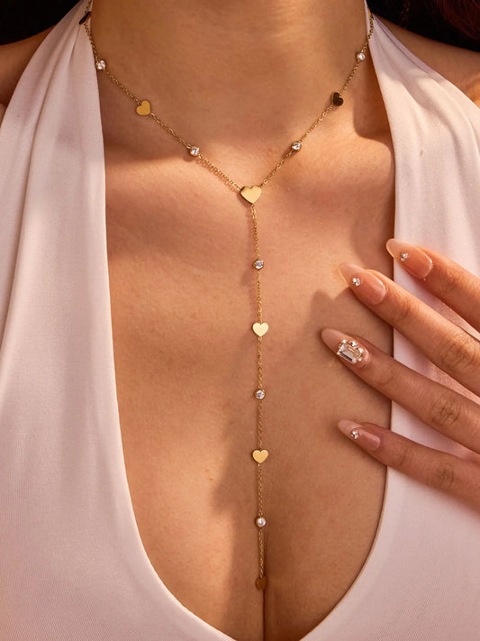 Woman wearing 18K gold plated heart zircon necklace with crystal charm 