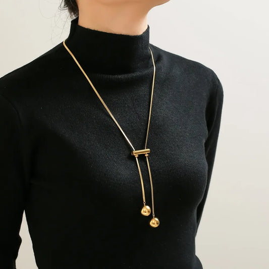 Sculptural gold statement necklace for layering or solo wear on model