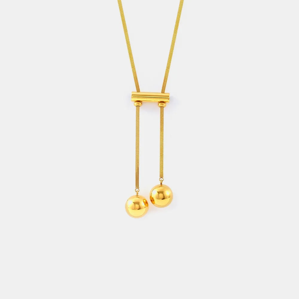 18K gold plated hollow bead necklace in titanium steel on white background
