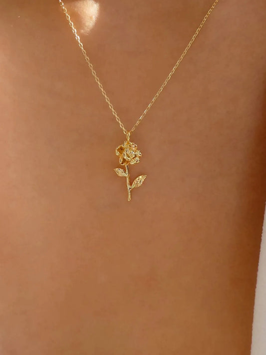 Woman wearing rose pendant necklace in 18K gold finish