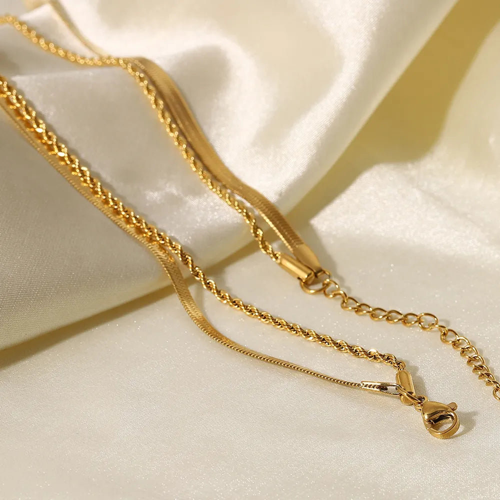 18K gold plated double layered necklace for women on satin fabric close up with hook