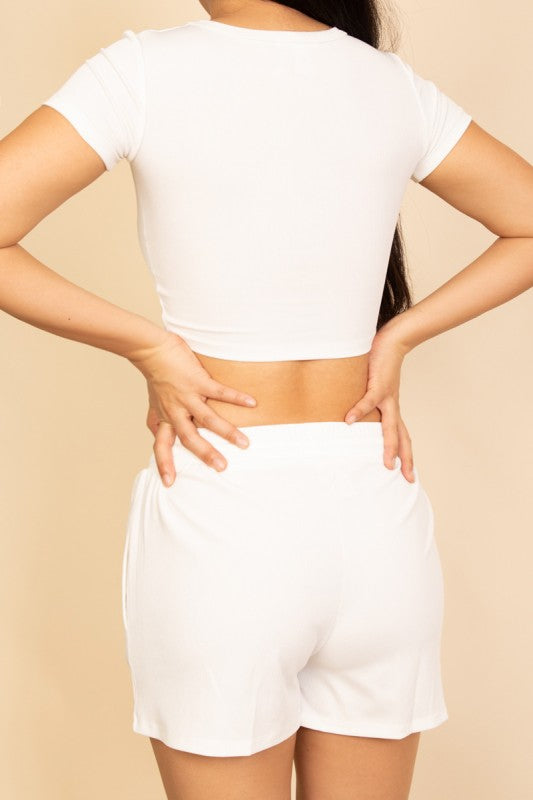 white everyday basics cozy two piece crop top and shorts loungewear for women on a model close up back view