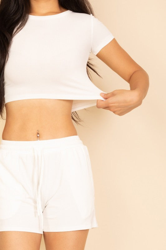 close up front view showing stretch fabric of white everyday basics cozy two piece crop top and shorts loungewear for women