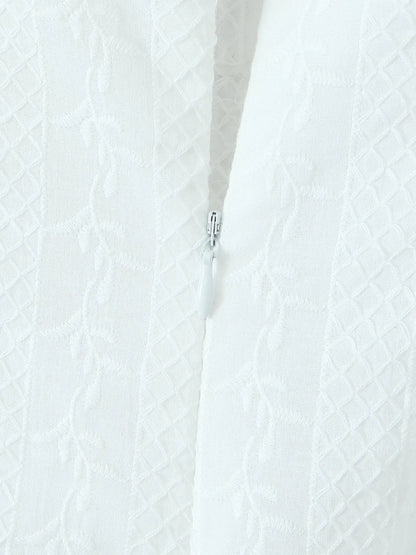Close-up of lace mini dress in white zipper and fabric texture 