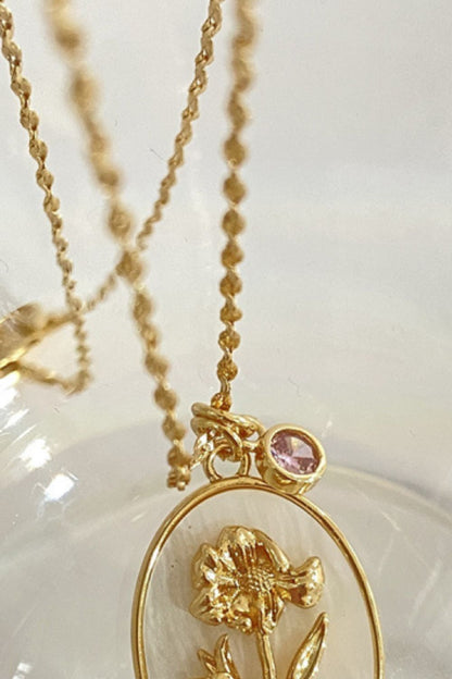 14K gold plated pendant necklaces with feminine floral design close up