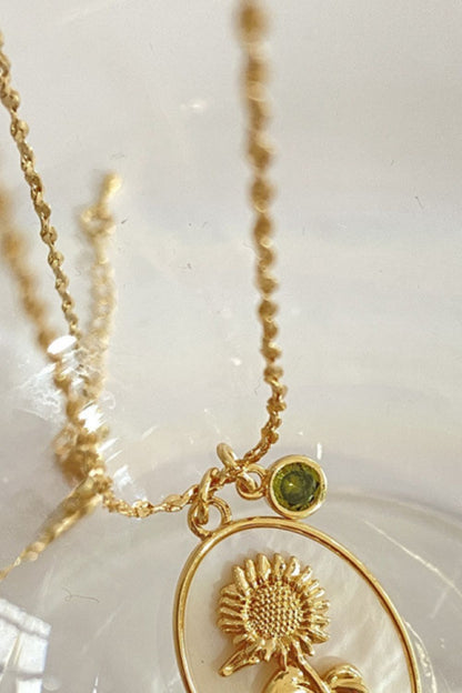 14K gold plated pendant necklaces with feminine floral design close up