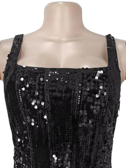 Black sequin dress on a mannequin with a white background