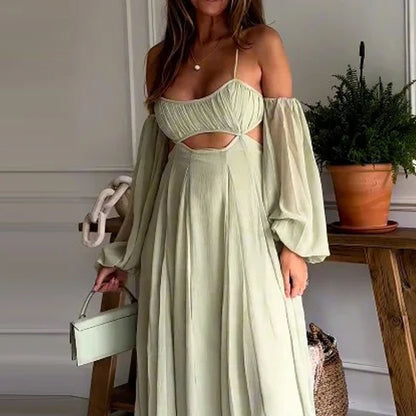 close up view of backless sleeveless flowy light green / sage maxi dress with flowy skirt and hollow out detail
