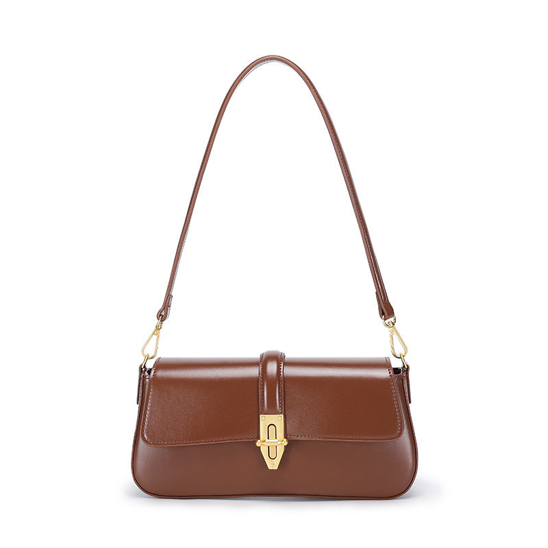 Brown real leather baguette purse with a gold clasp on a white background