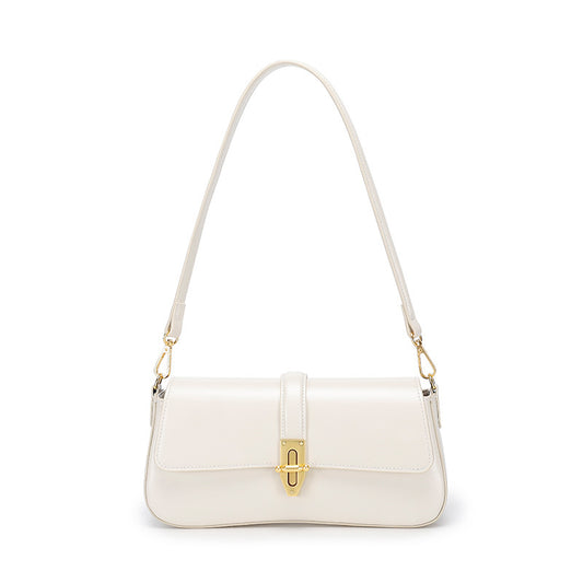 White real leather women's handbag with a gold clasp on a white background