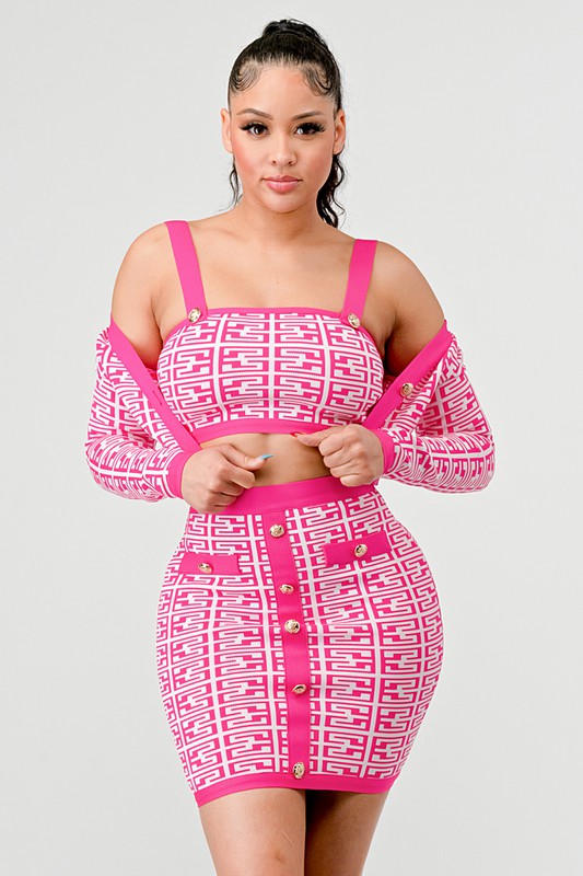 woman wearing a pink coordinated bandage three piece outfit : crop top, long sleeve top and bodycon mini skirt