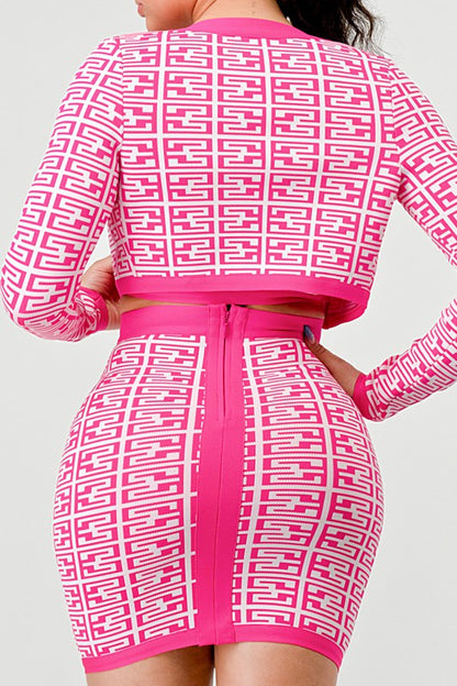 Model wearing pink printed three-piece bandage set with long sleeve top, crop, and skirt back view 