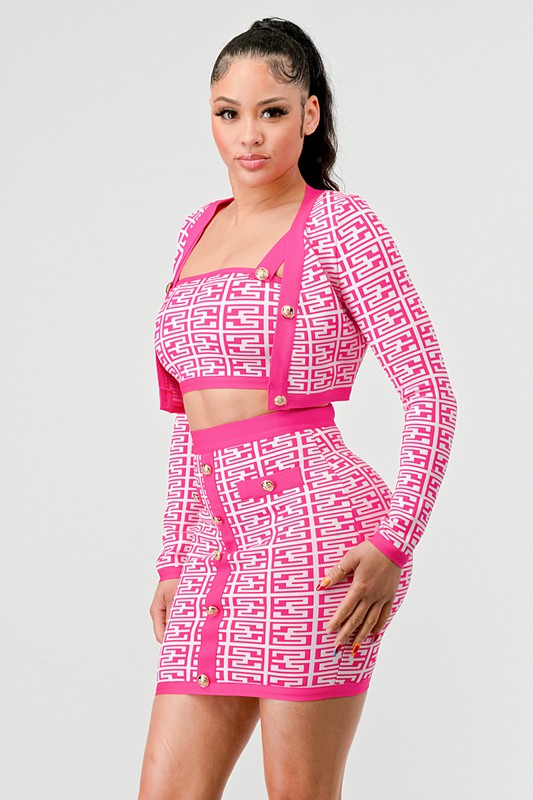 side view of woman wearing a pink three piece bandage bodycon skirt set on a white background