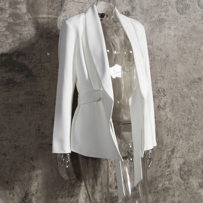 Luxury minimalist white belted blazer for two-piece suit for women on a mannequin