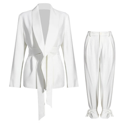 Couture-style women’s white suit set for formal occasions on a white background
