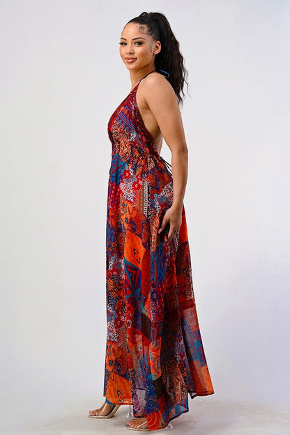 side view of woman wearing a bohemian sequin lace backless maxi dress with plunging halter neckline and flowing silhouette