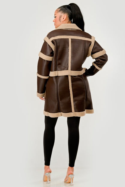 Woman wearing a Brown Faux Leather Shearling Trim Coat on a white background back view
