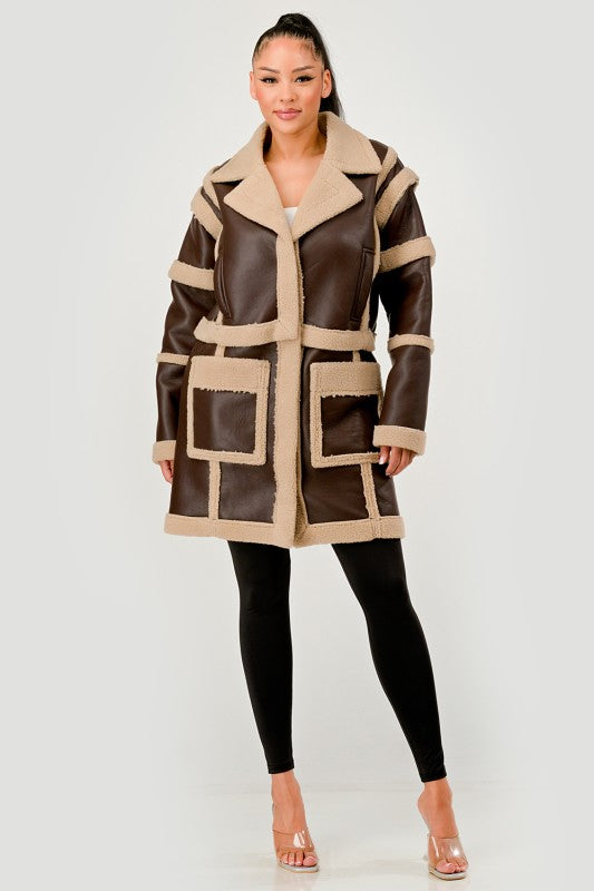 Woman wearing Brown Faux Leather Shearling Trim Coat on a white background front view