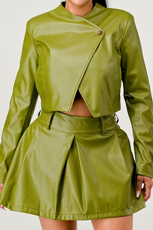 Front view of women’s olive green PU leather jacket and skirt set close up