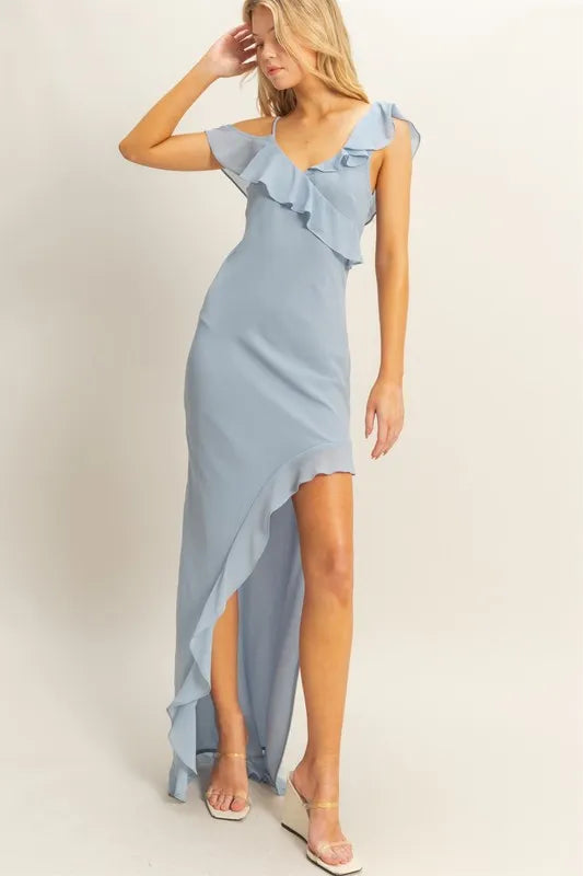 Model posing in chiffon ruffle trim midi dress with v-neckline