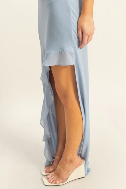 Close-up of ruffle trim and chiffon texture of midi dress on model