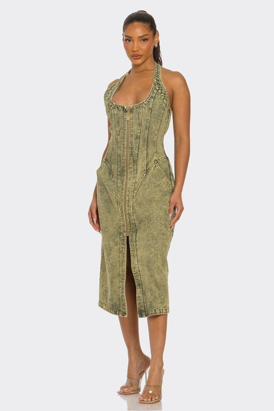 woman wearing green acid wash halter denim midi dress with backless design and front slit front view