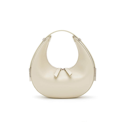 beige/off white mini crescent shoulder genuine leather handbag with zipper closure on a white background