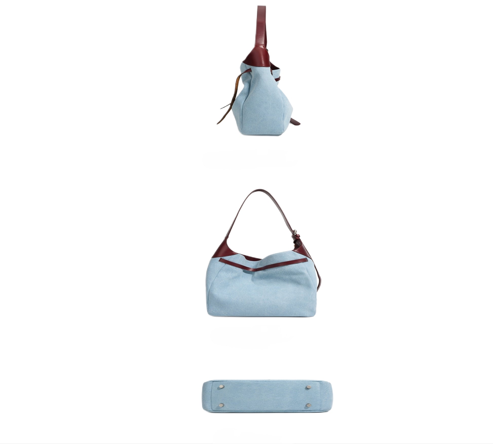 Side, bottom, and back view of light blue denim shoulder tote handbag with burgundy genuine leather accents on a white background