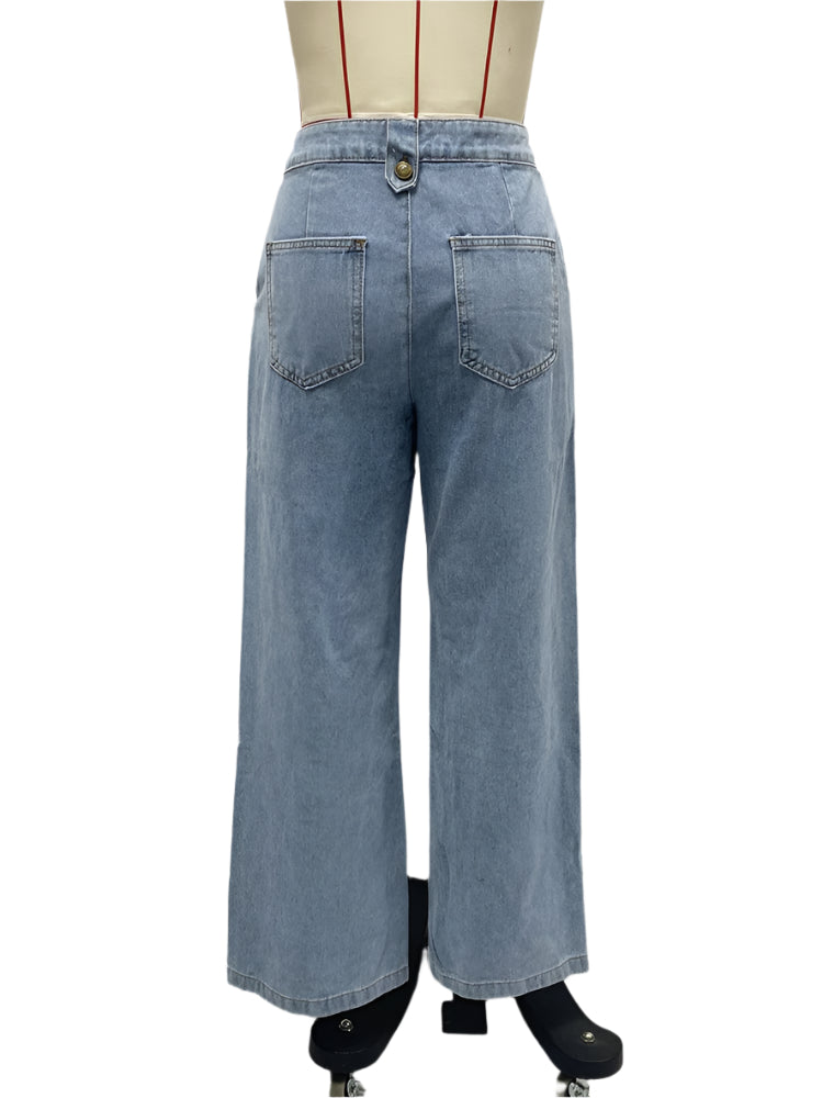 back view of blue high waist wide leg jeans on a mannequin against a white background