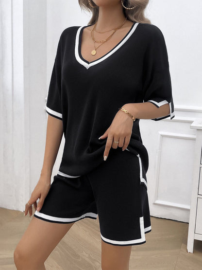 Casual two-piece summer outfit with shorts and top in black on model front view